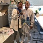 Students posing in smocks