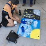 Student working on painting